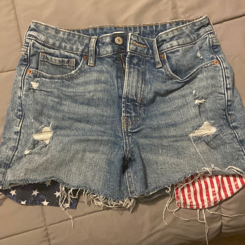 Denim shorts with American flag pockets